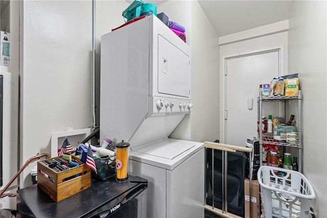 clothes washing area with stacked washer / drying machine