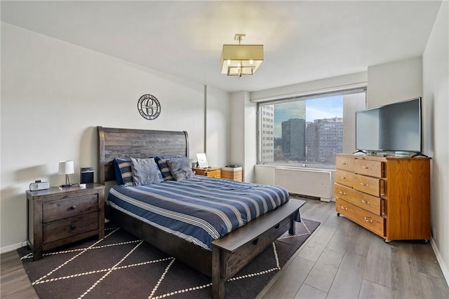 bedroom with wood-type flooring