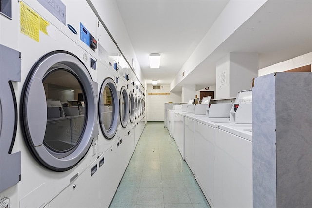 laundry area with stacked washing maching and dryer and separate washer and dryer