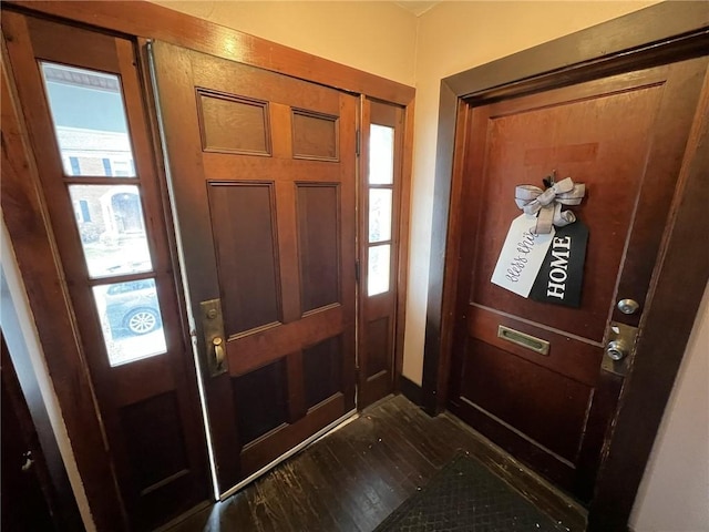 foyer entrance with dark hardwood / wood-style floors