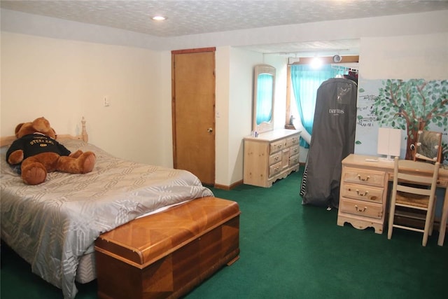 carpeted bedroom featuring a textured ceiling and a closet