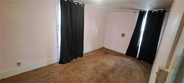 unfurnished room featuring carpet flooring