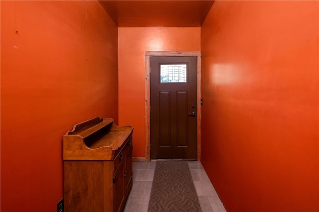 doorway featuring light tile patterned floors