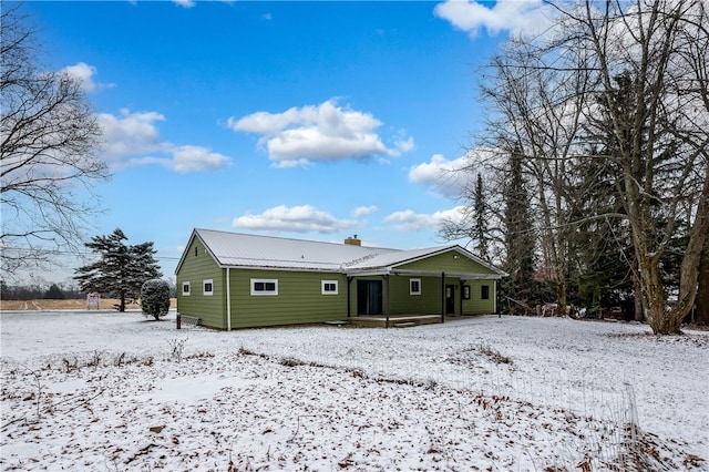 view of snow covered house