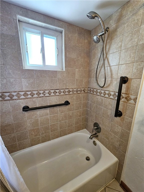 bathroom with shower / bath combo