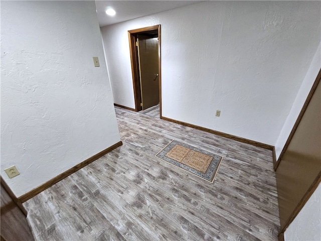 unfurnished room with light hardwood / wood-style flooring