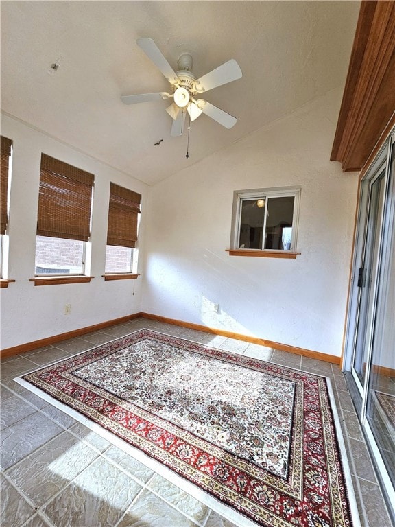 spare room featuring ceiling fan and lofted ceiling