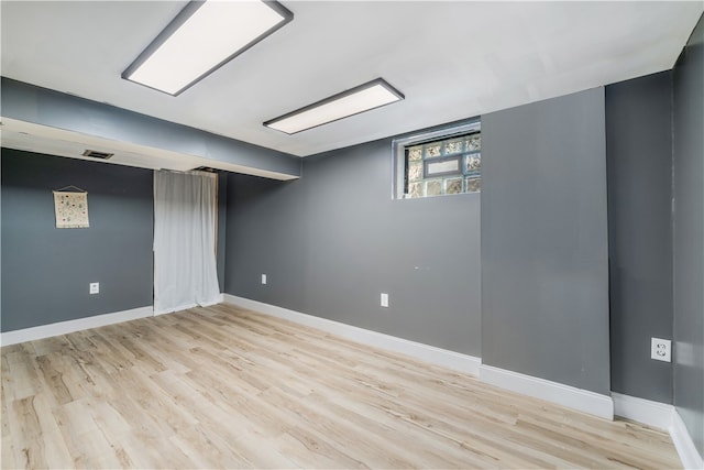 basement featuring light hardwood / wood-style flooring