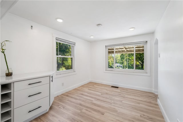 spare room featuring light hardwood / wood-style flooring