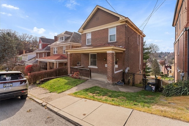 front of property with a porch and a front yard