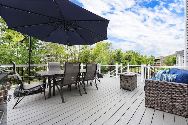 wooden terrace with an outdoor hangout area