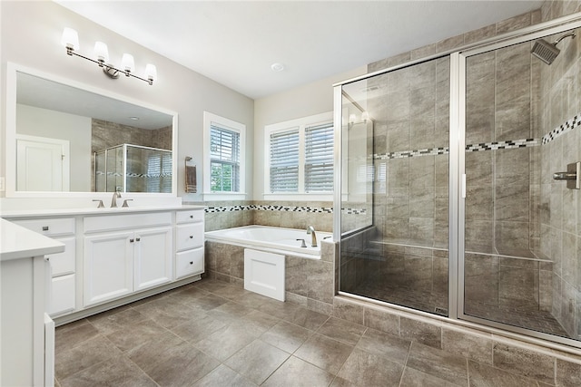 bathroom featuring plus walk in shower and vanity