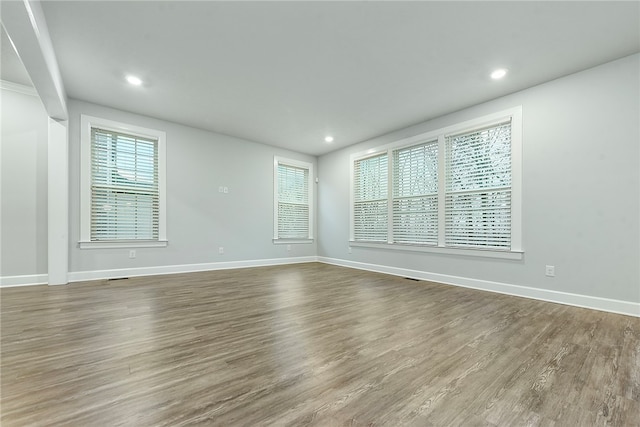 spare room featuring dark hardwood / wood-style flooring