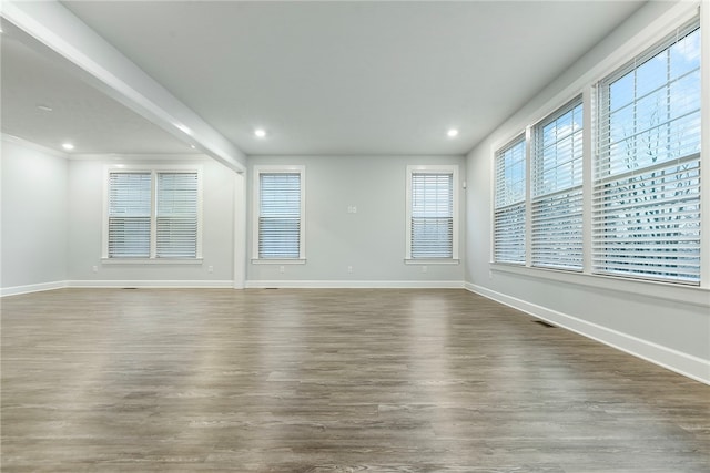 unfurnished room featuring dark hardwood / wood-style floors