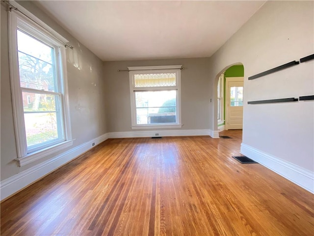 empty room with light hardwood / wood-style floors