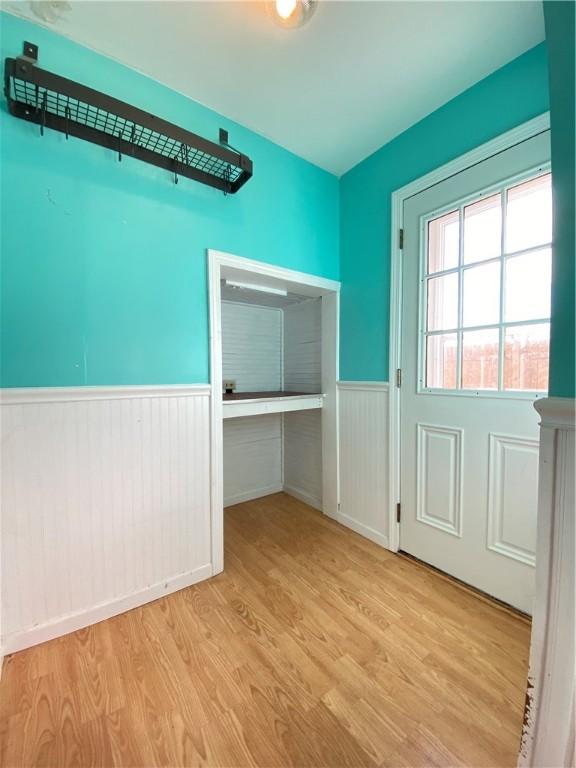 spare room with light hardwood / wood-style flooring