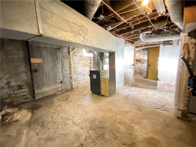 basement featuring heating unit