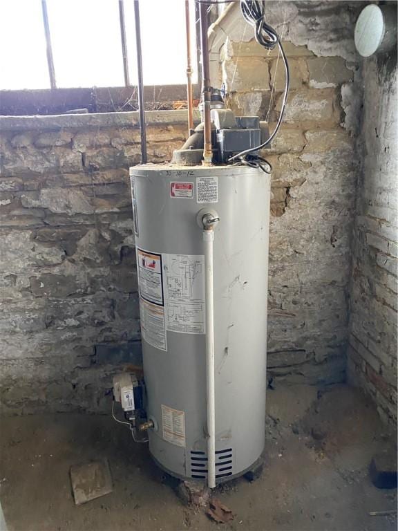 utility room featuring gas water heater