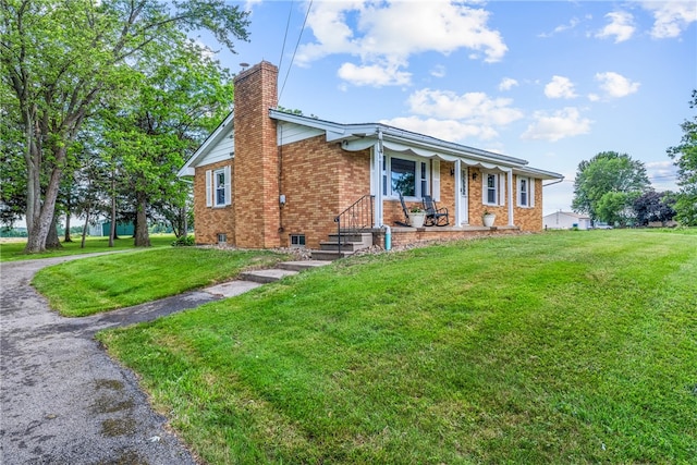 ranch-style house with a front lawn