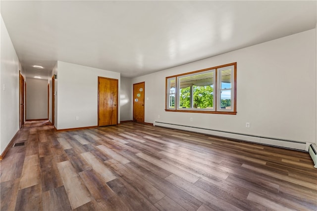 interior space with hardwood / wood-style floors and baseboard heating