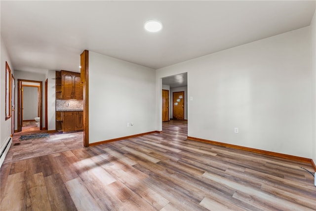 unfurnished room with light hardwood / wood-style flooring