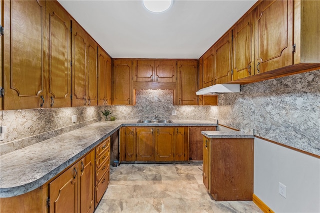 kitchen with decorative backsplash and sink