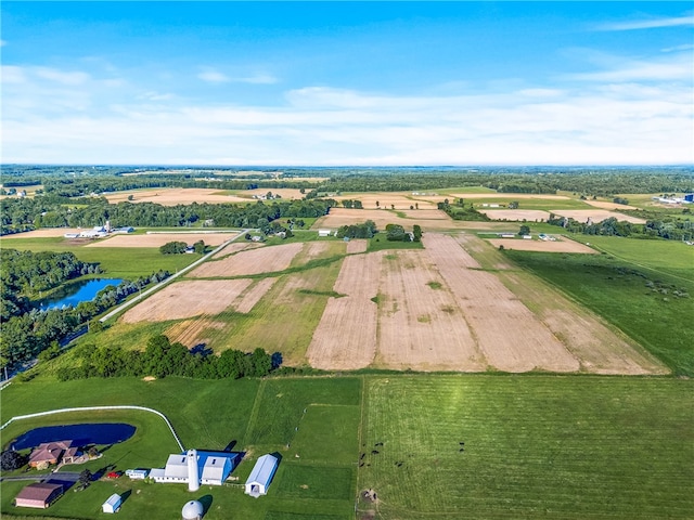 aerial view with a rural view and a water view