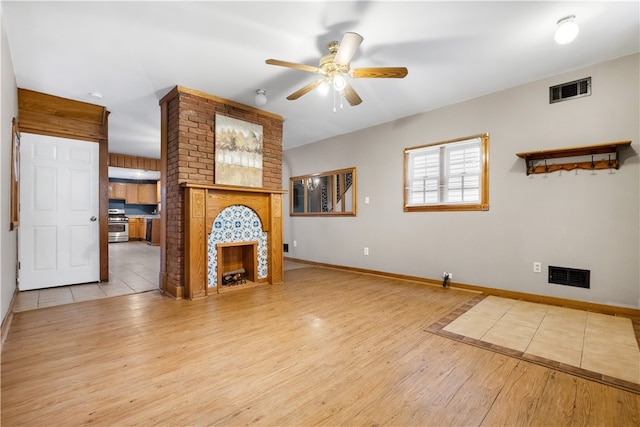 unfurnished living room with light wood-type flooring and ceiling fan