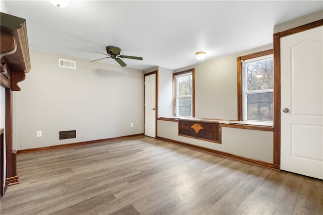 interior space featuring ceiling fan and light hardwood / wood-style flooring