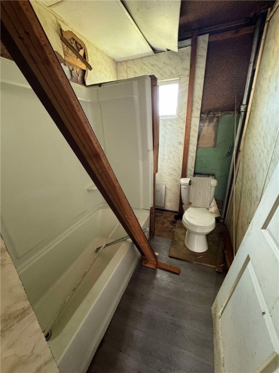 bathroom featuring wood-type flooring and toilet