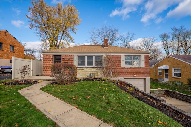 view of front facade featuring a front yard and a garage