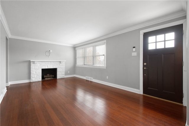 unfurnished living room with a stone fireplace, a wealth of natural light, hardwood / wood-style floors, and ornamental molding