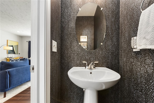 bathroom featuring sink and hardwood / wood-style flooring