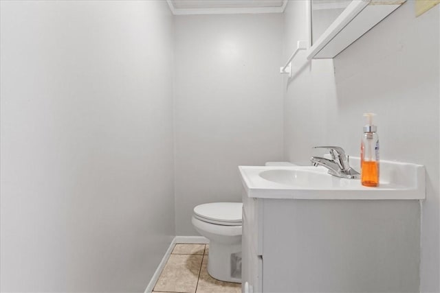 bathroom featuring tile patterned flooring, vanity, and toilet