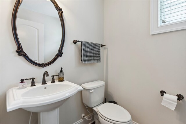 bathroom with sink and toilet