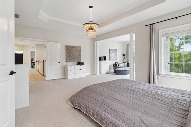 bedroom featuring a tray ceiling, an inviting chandelier, light colored carpet, and crown molding