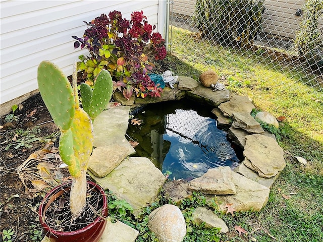 exterior details with a small pond