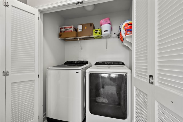 laundry room featuring independent washer and dryer