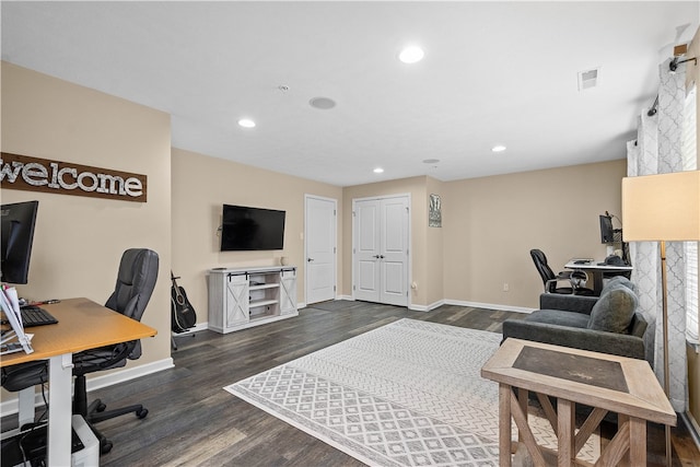 office space with dark wood-type flooring