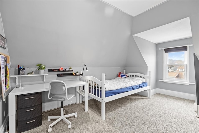 carpeted bedroom with vaulted ceiling