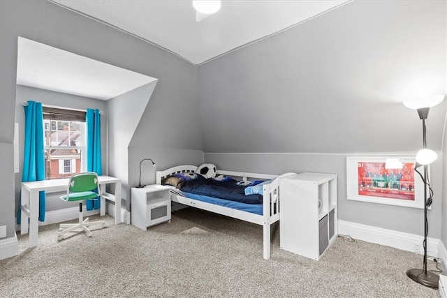 bedroom featuring carpet flooring and vaulted ceiling