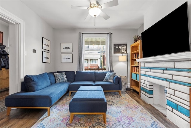 living room featuring hardwood / wood-style flooring and ceiling fan