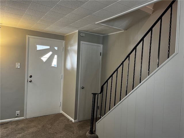 view of carpeted foyer entrance