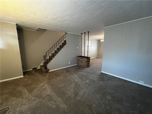 unfurnished living room featuring dark colored carpet