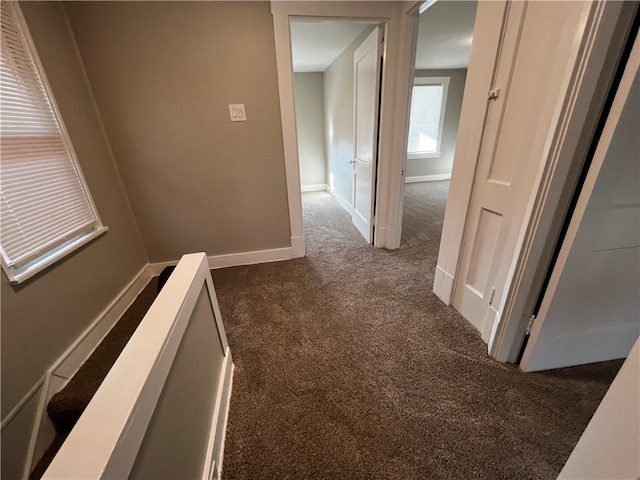 hallway with dark carpet