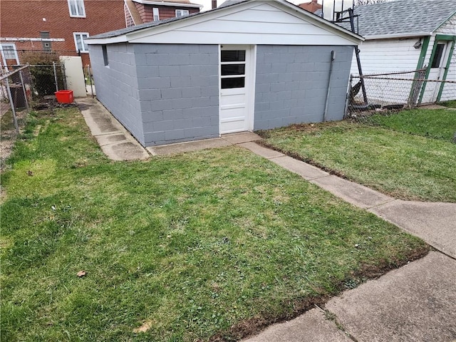 view of outbuilding featuring a yard