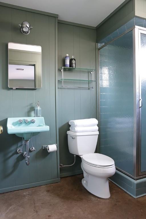 101 Point Breeze Pl, Point Breeze, PA 15208 - bathroom featuring a shower stall, concrete floors, and a decorative wall