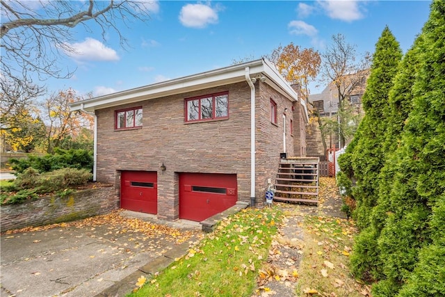 view of side of home with a garage