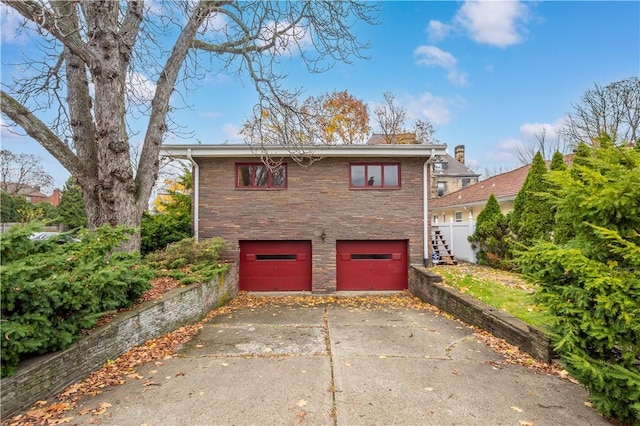 view of side of home with a garage