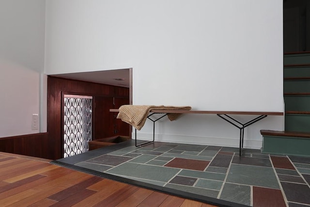 101 Point Breeze Pl, Point Breeze, PA 15208 - stairway featuring wood walls, a high ceiling, and wood finished floors